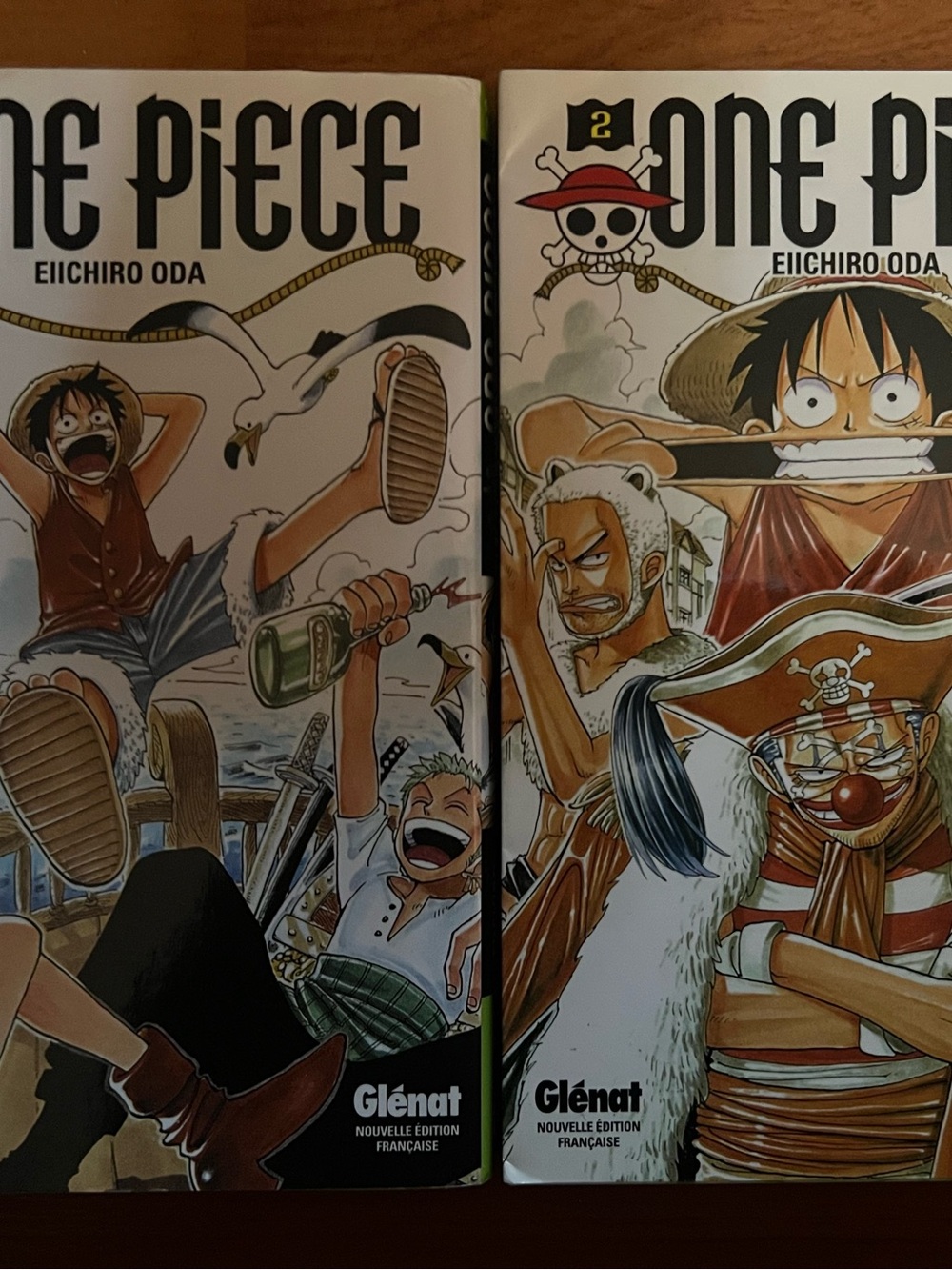 Volumes 1 & 2 of the One Piece manga series, published in French by Glénat